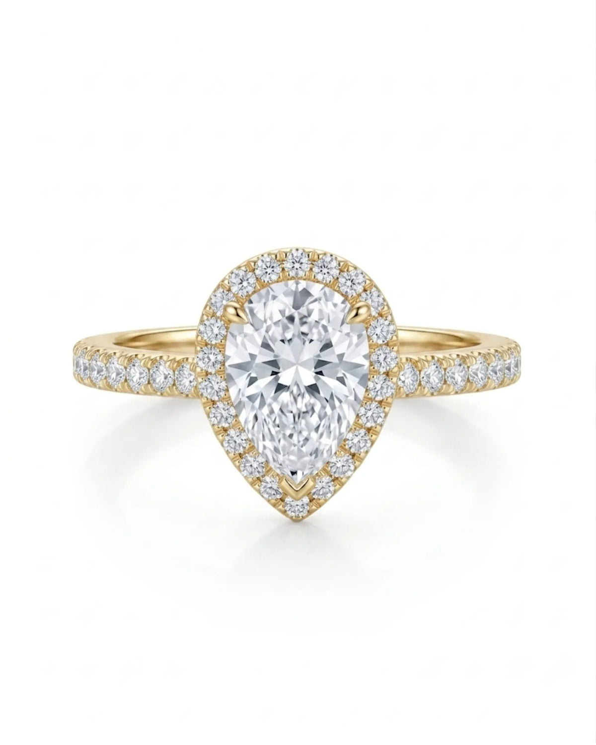 Sculpted teardrop moissanite ring with elevated halo setting crafted in warm 18K yellow gold | SARATTI