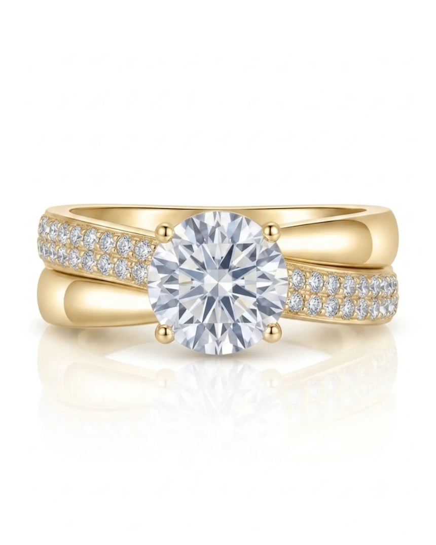 Sculptural split shank moissanite ring with polished ribbon and pavé detailing in 18K yellow gold | SARATTI