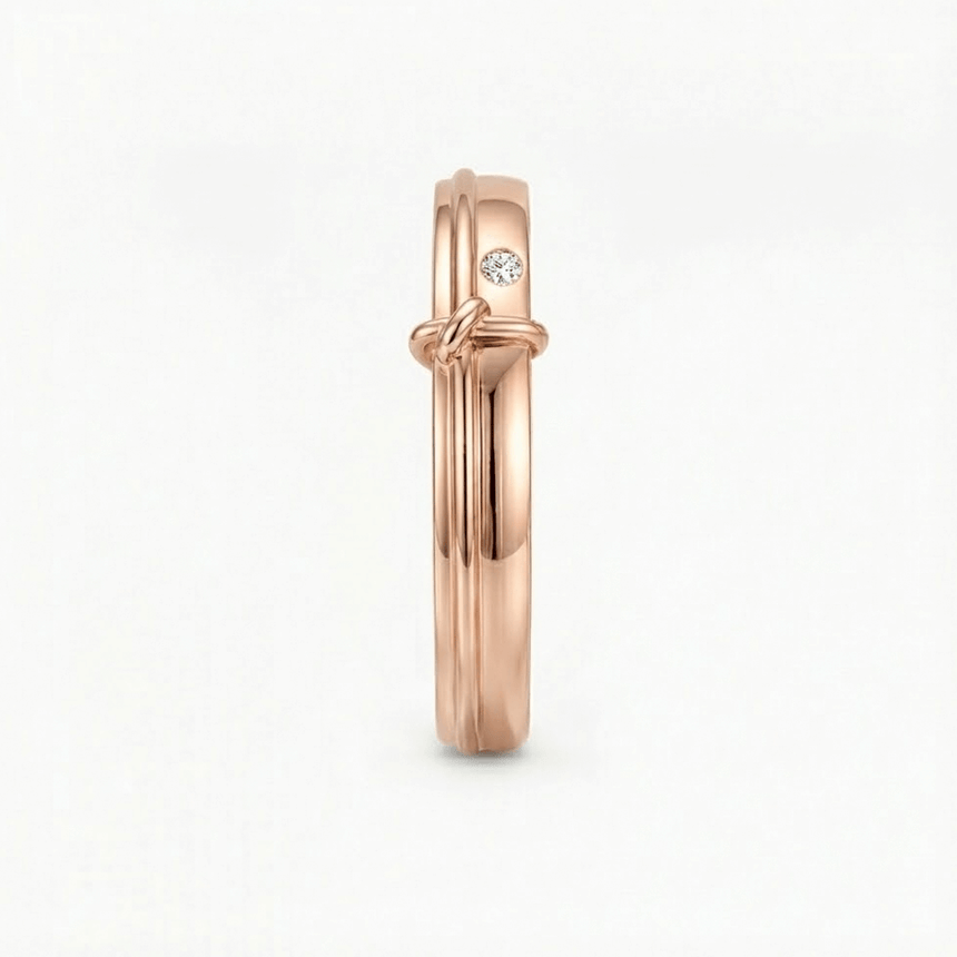 Rose gold ring with a diamond on a white background | Side View of 18K Rose Gold Men’s Band with 0.03ct Bezel-Set Diamond – SARATTI