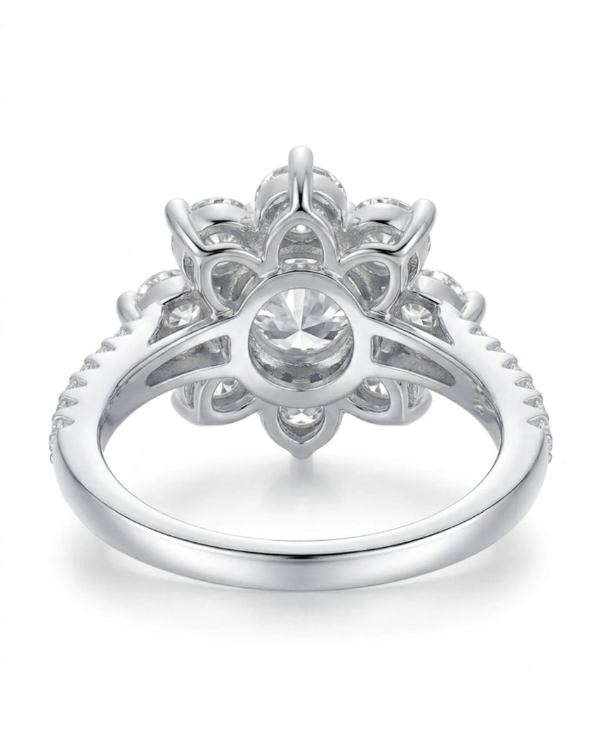 Statement floral moissanite engagement ring with pavé shoulders crafted in polished platinum | SARATTI