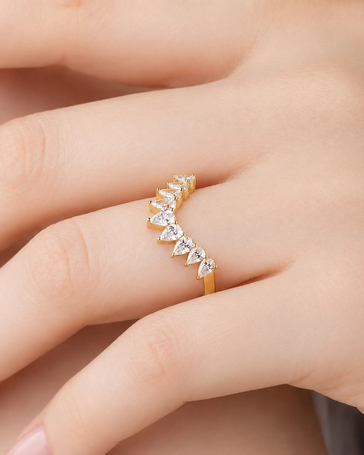Tiara-inspired curved wedding band with pear-shaped diamonds in polished 18K yellow gold, half-eternity design | SARATTI
