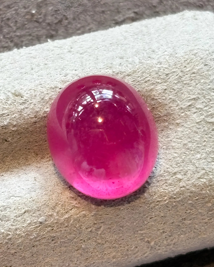 Treated glass-filled Natural Ruby oval cabochon detail | SARATTI
