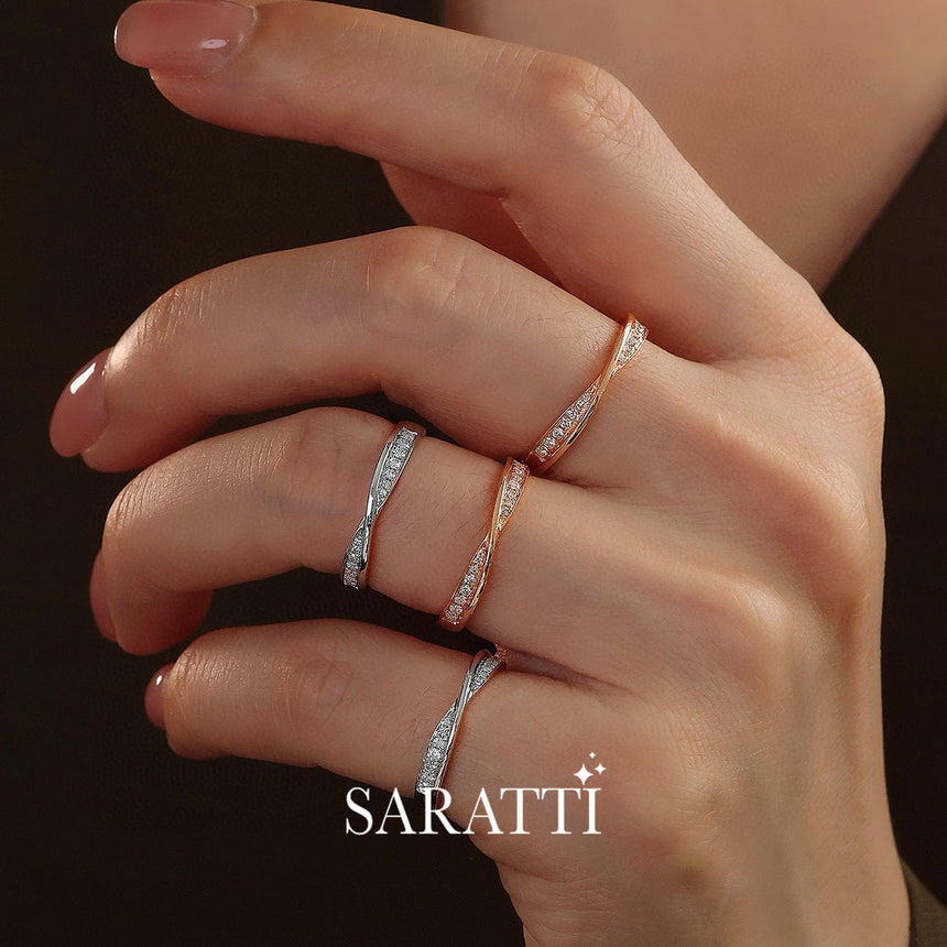 Close up shot of Model's Hand with the Twisted Shank Diamond Eternity Wedding Bands in White and Rose Gold | Saratti