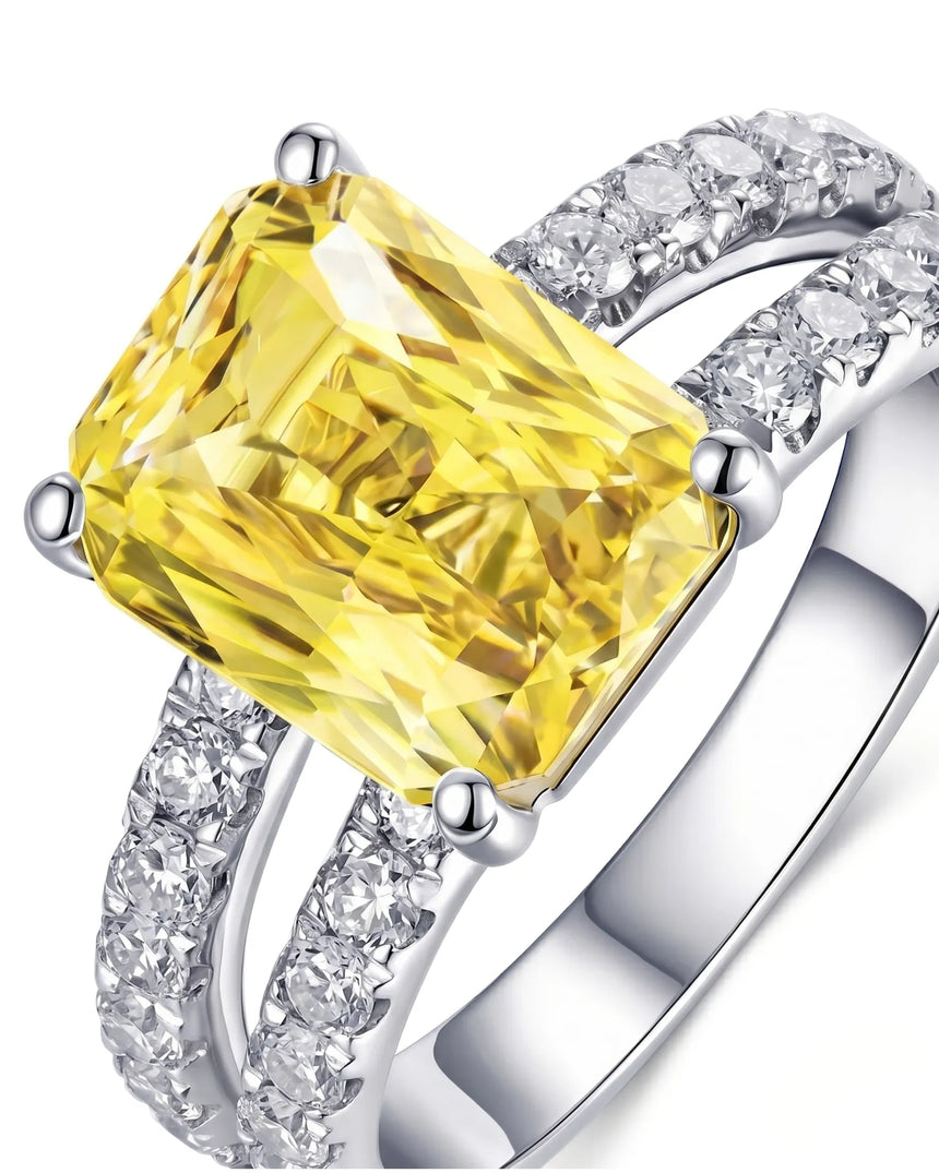 Unheated radiant yellow sapphire ring framed by round brilliant diamonds in platinum | SARATTI