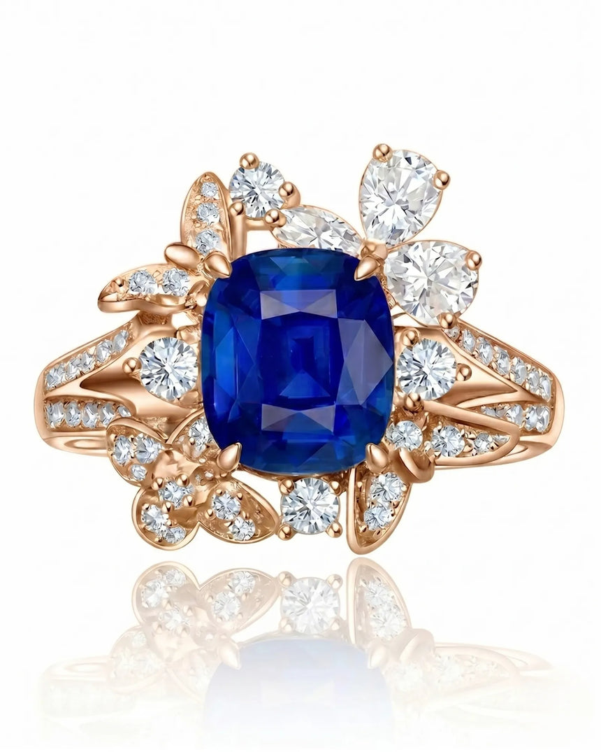 Unheated royal blue sapphire ring framed by luminous diamonds in 18K rose gold | SARATTI