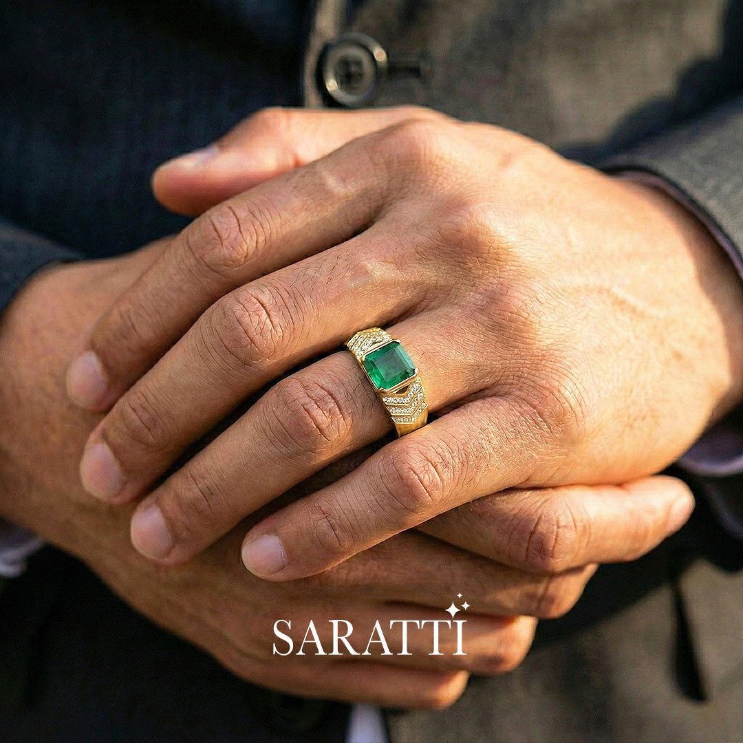 Mens emerald ring emerald cut center stone detail in 18K yellow gold | SARATTI