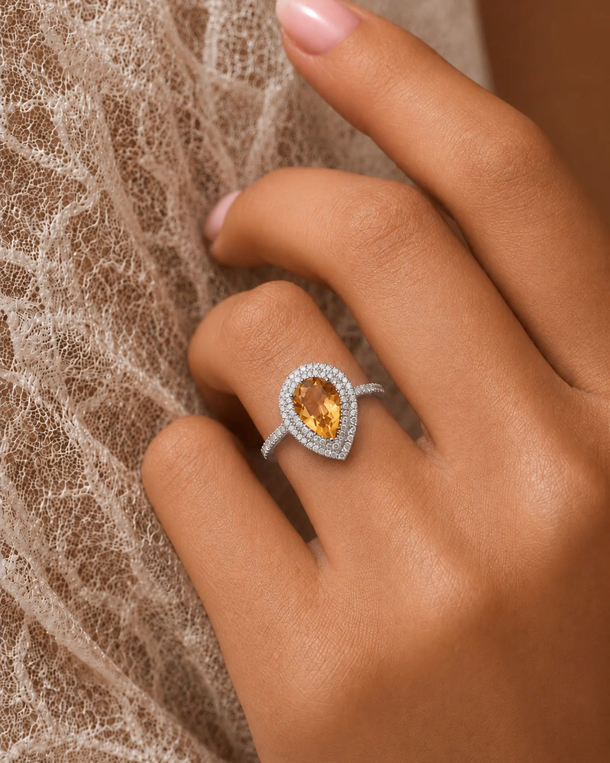 Vibrant yellow citrine contrasted by round brilliant diamonds in a refined 18K white gold ring | SARATTI