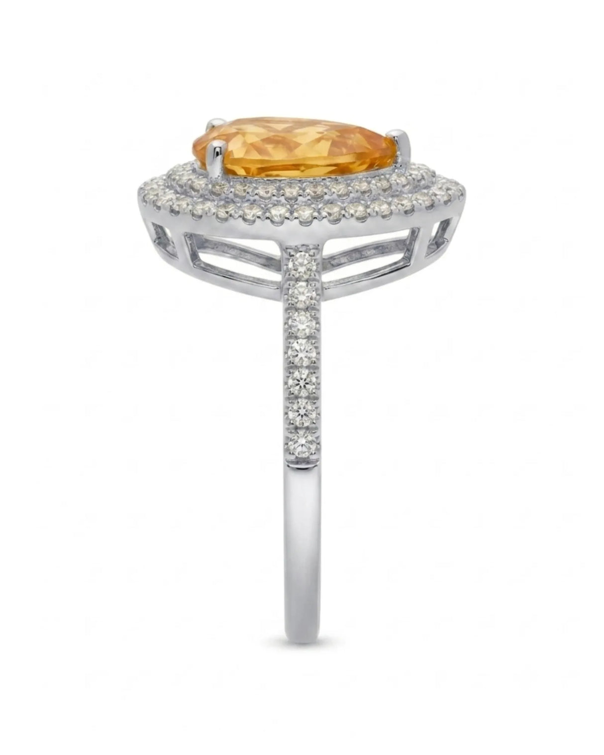Vibrant yellow pear-cut citrine contrasted by brilliant diamonds in a refined platinum ring | SARATTI