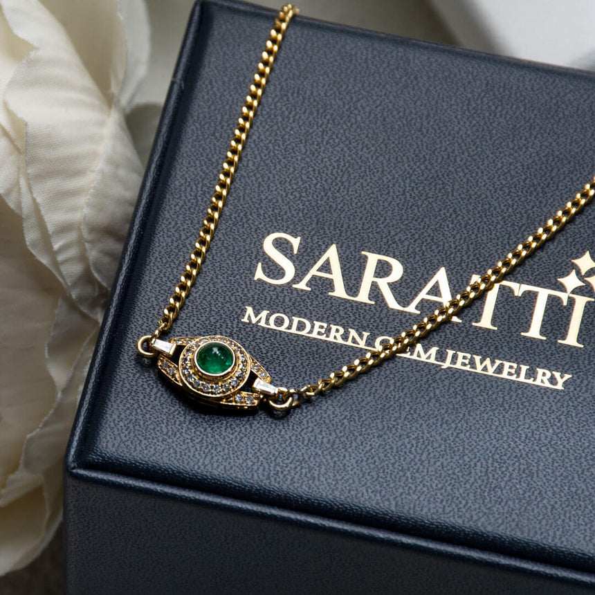 Anima Hera Emerald Pendant Necklace against Saratti background | Saratti Fine Jewelry