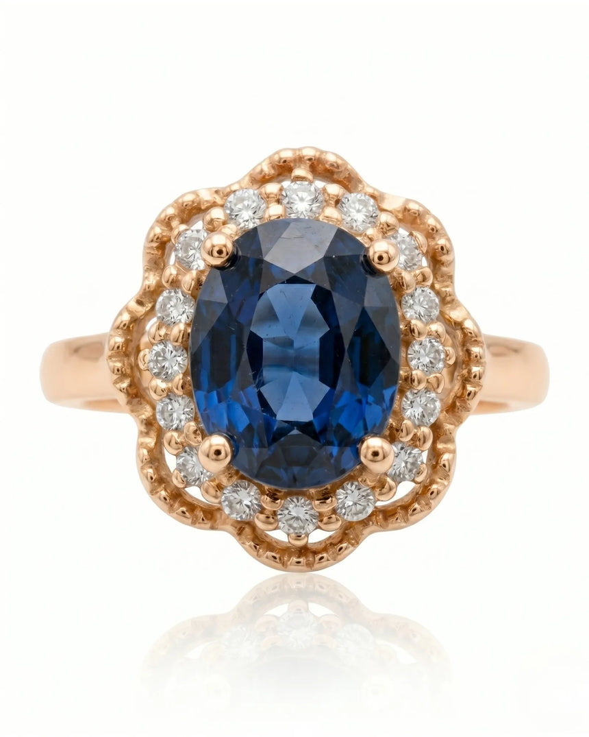 Vintage-inspired sapphire ring with floral diamond halo in romantic rose gold | SARATTI