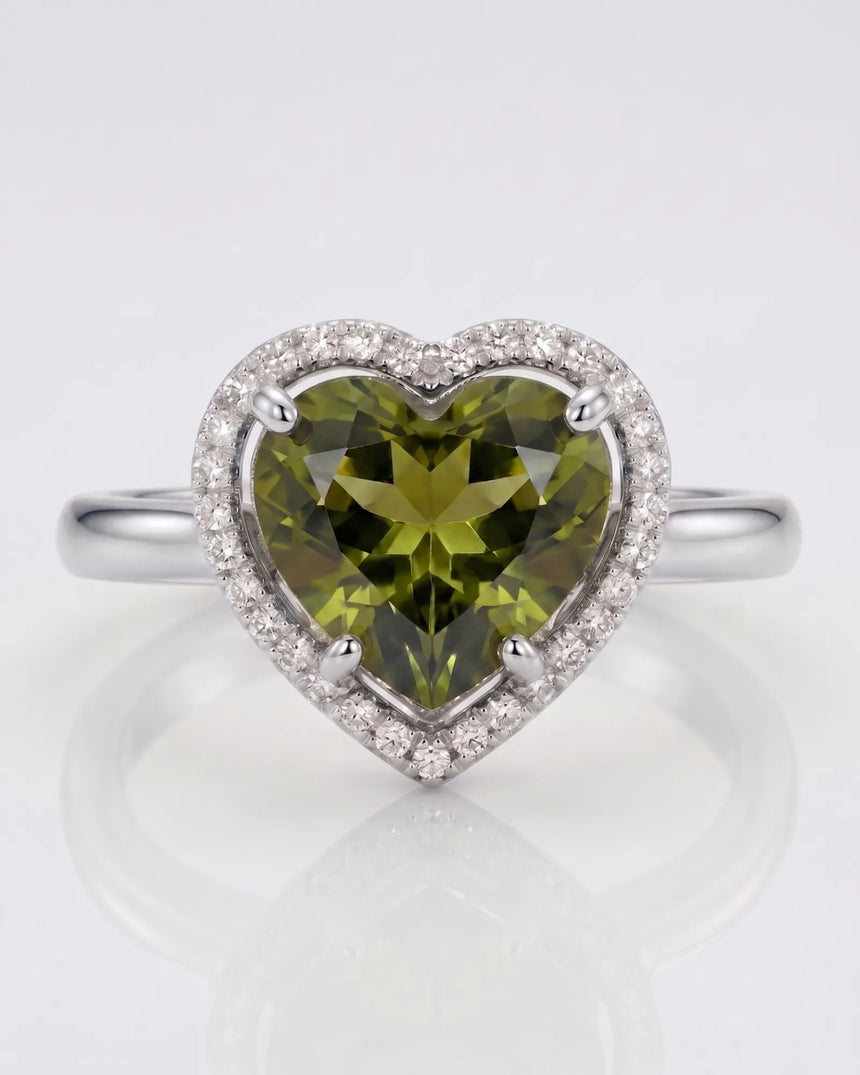 Vivid green heart tourmaline ring framed by natural diamonds in platinum | SARATTI