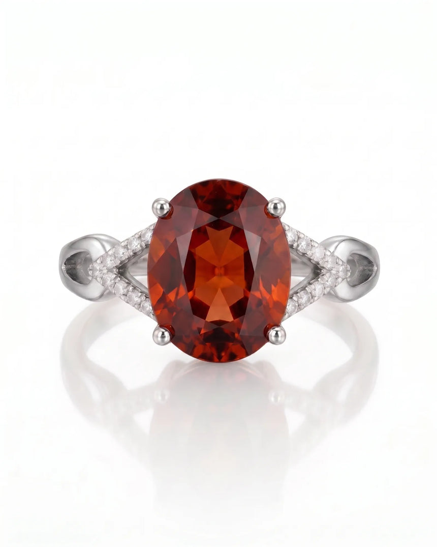 Vivid orange oval garnet ring with natural diamond shoulders in platinum | SARATTI