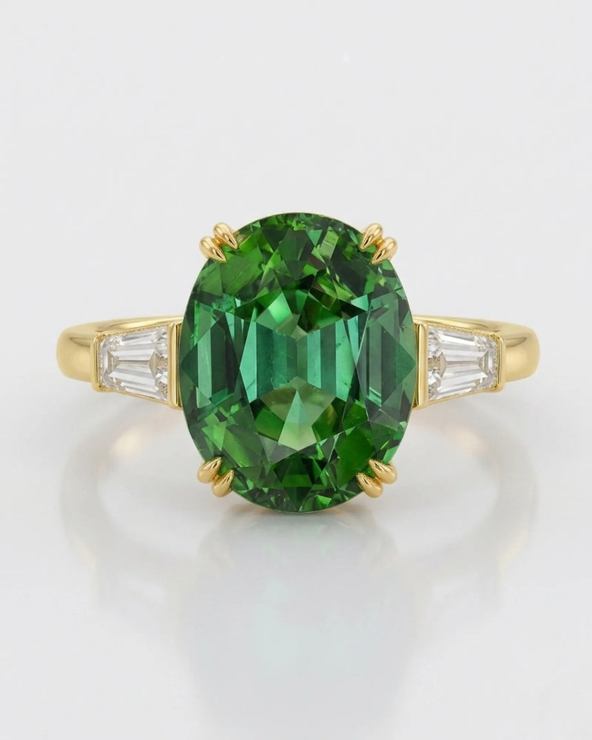 Vivid oval tourmaline ring with emerald-cut diamonds in polished 18K yellow gold | SARATTI