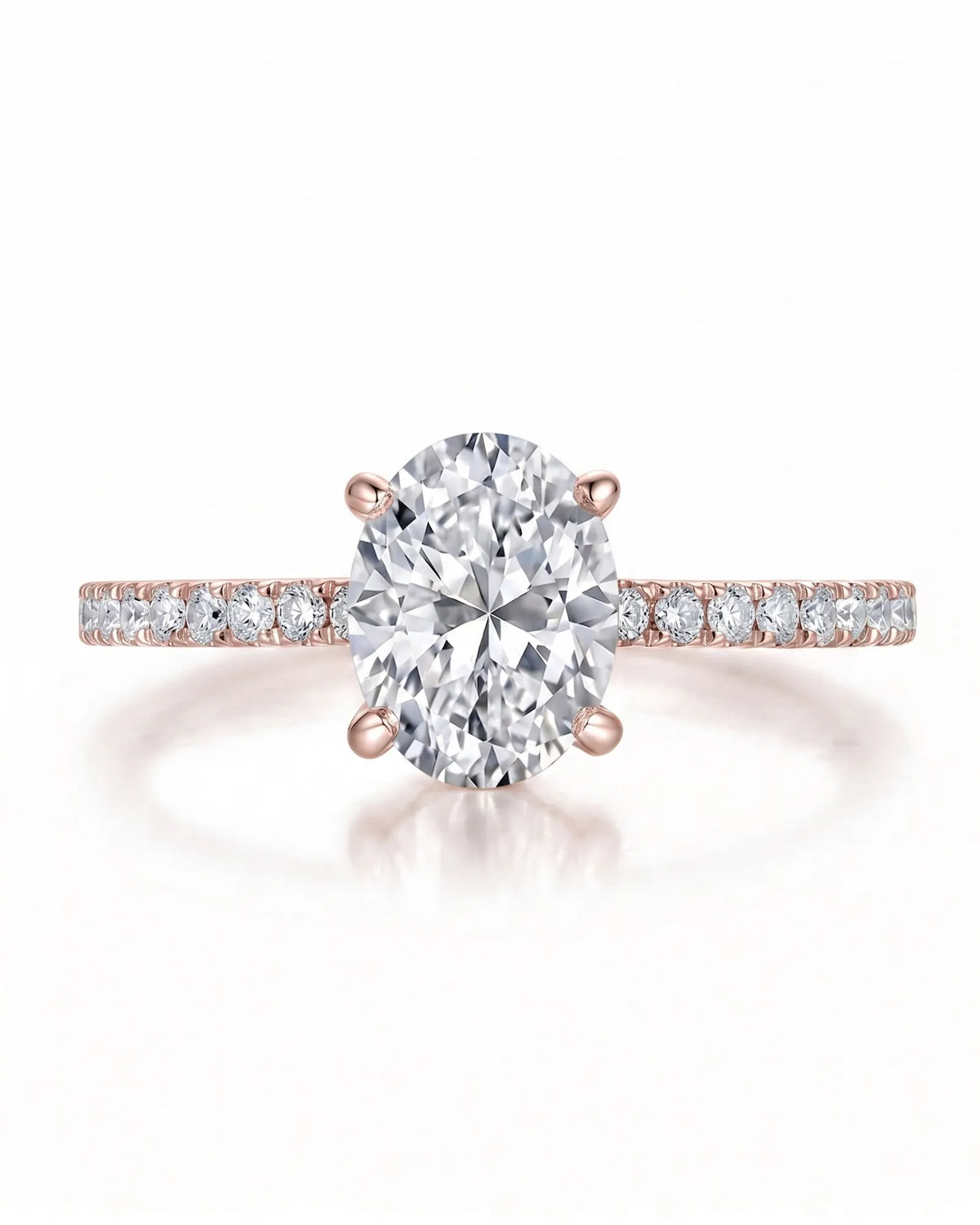 Adriana 1 carat F-colour oval natural diamond hidden halo ring in 18K rose gold, front view of oval centre and pavé shoulders | SARATTI