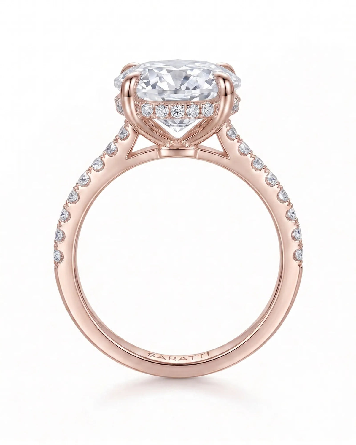 Adriana 1 carat F-colour oval natural diamond hidden halo ring in 18K rose gold, side profile showing hidden halo and raised gallery | SARATTI