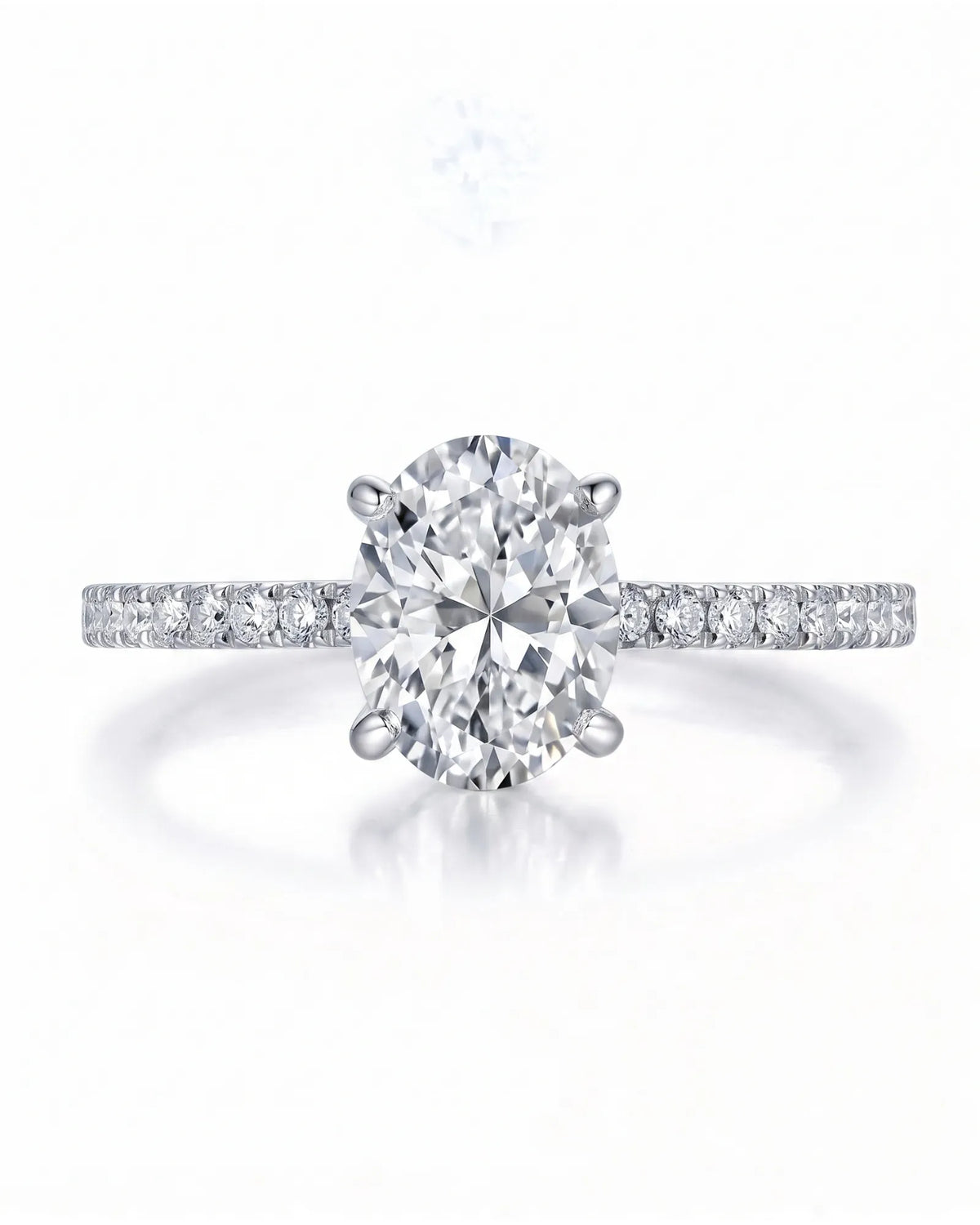 Adriana 1 carat F-colour oval natural diamond hidden halo ring in 18K white gold, front view of oval centre and pavé shoulders | SARATTI