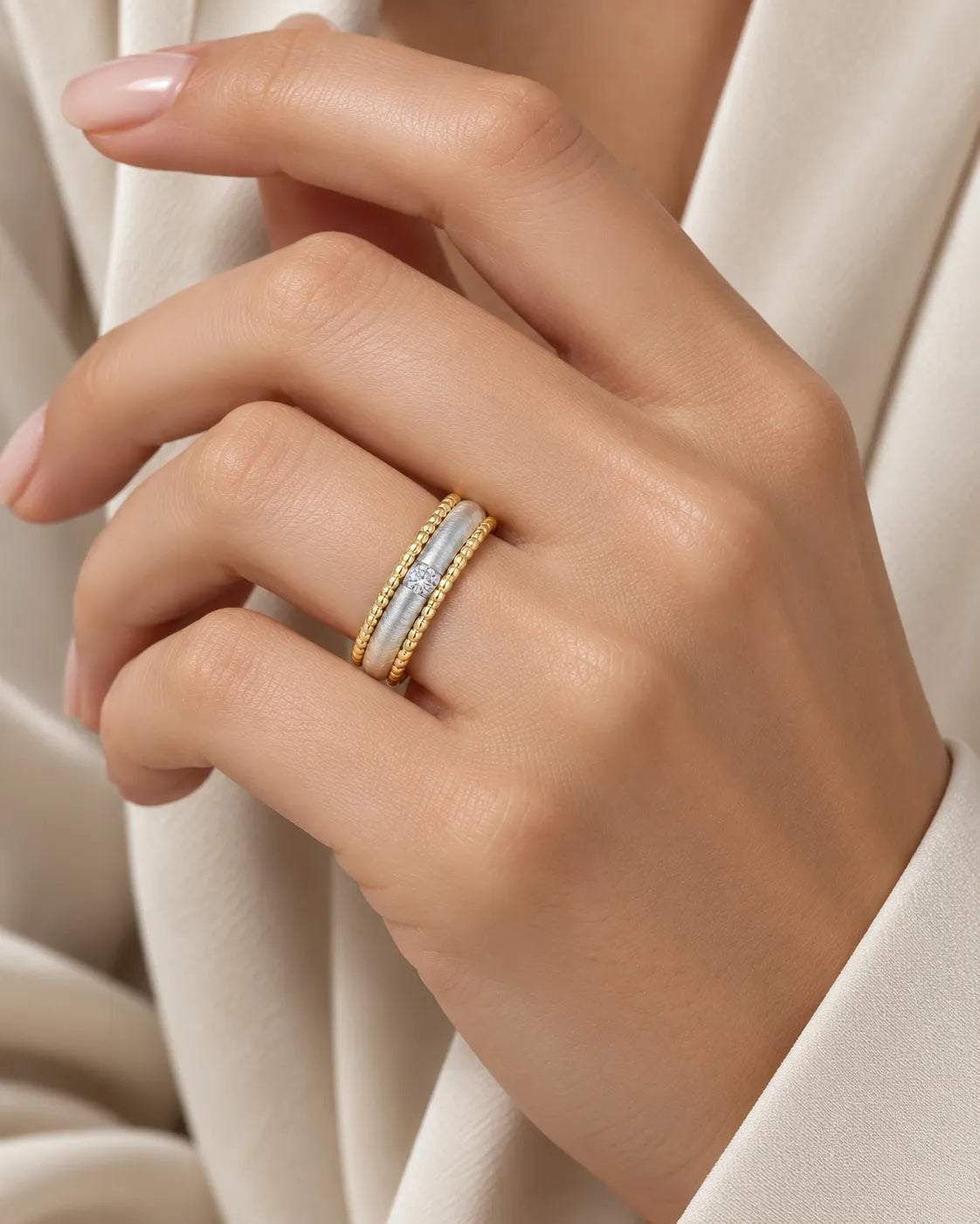 Art Nouveau two-tone diamond wedding band worn on hand in 18K yellow and white gold | SARATTI