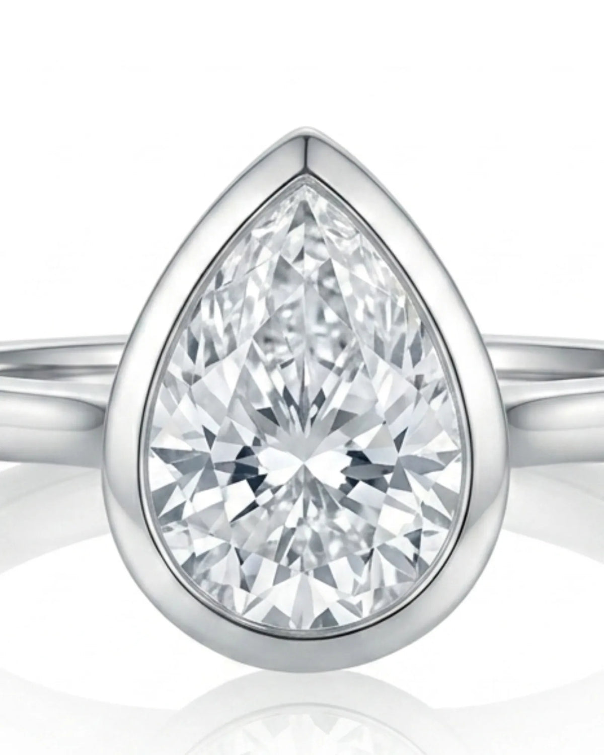 Aurelia's Embrace pear-cut natural diamond bezel engagement ring in 18K white gold, close-up of diamond and bezel setting | SARATTI