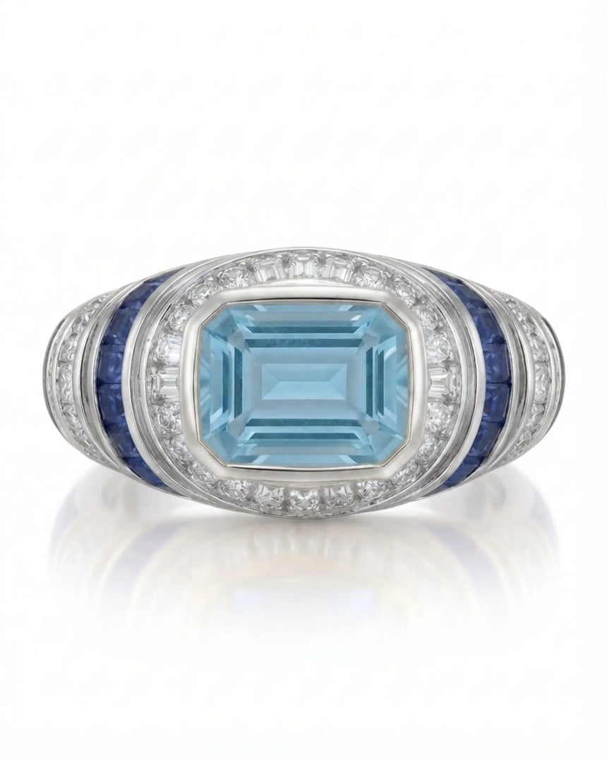Azzurro Regent emerald-cut Aquamarine cocktail ring setting in Platinum, front view with baguette diamond frame and blue sapphire channels | SARATTI