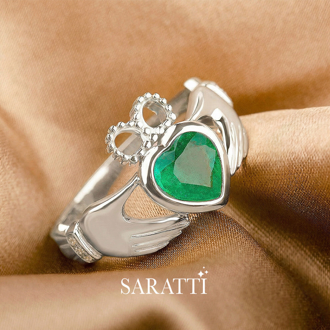 coronet heart emerald claddagh ring platinum with diamond shoulders | SARATTI