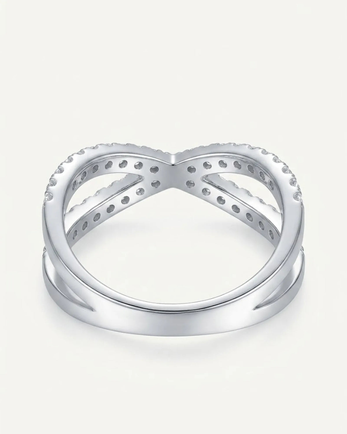 Criss cross diamond wedding ring in platinum showing the crossover silhouette and round diamond detailing | SARATTI
