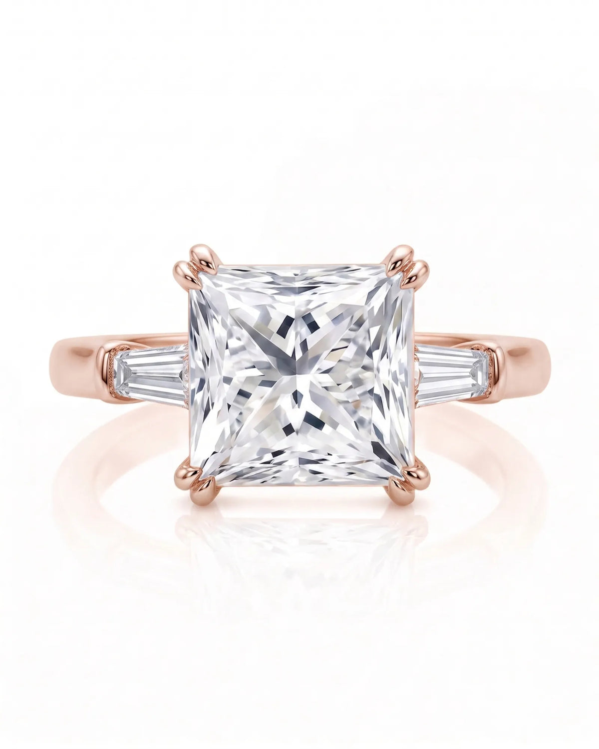 Diane 1 carat F-colour princess natural diamond three-stone ring in 18K rose gold, front view of princess centre and tapered side diamonds | SARATTI