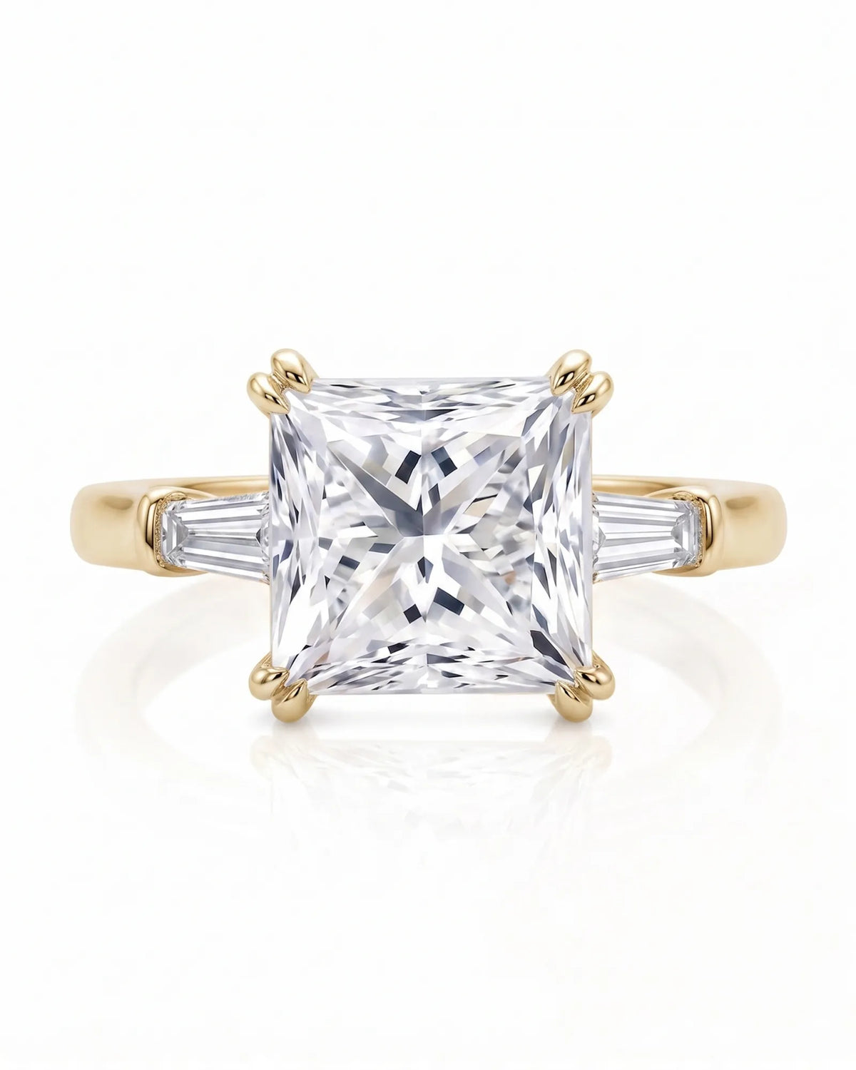 Diane 1 carat F-colour princess natural diamond three-stone ring in 18K yellow gold, front view of princess centre and tapered side diamonds | SARATTI