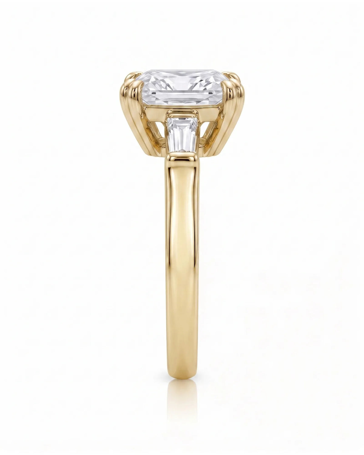 Diane 1 carat F-colour princess natural diamond three-stone ring in 18K yellow gold, side profile showing raised open three-stone gallery | SARATTI