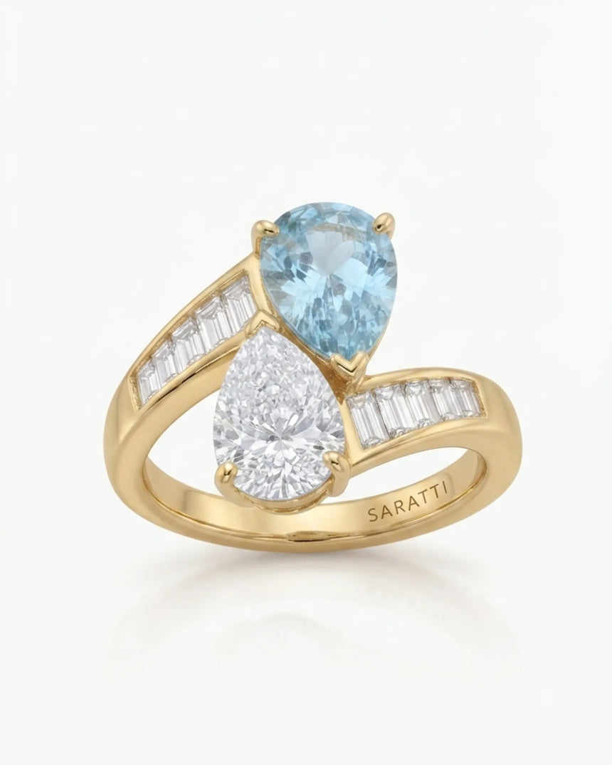 Élan Céleste pear-cut Aquamarine and diamond bypass ring setting in yellow gold, top view with tapered baguette shoulders | SARATTI