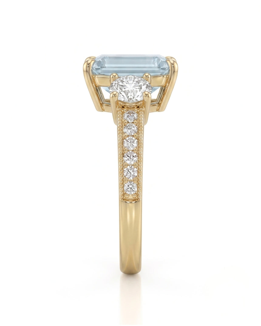 Étoile Trinity emerald cut Aquamarine three-stone diamond ring setting in Yellow Gold, side profile | SARATTI
