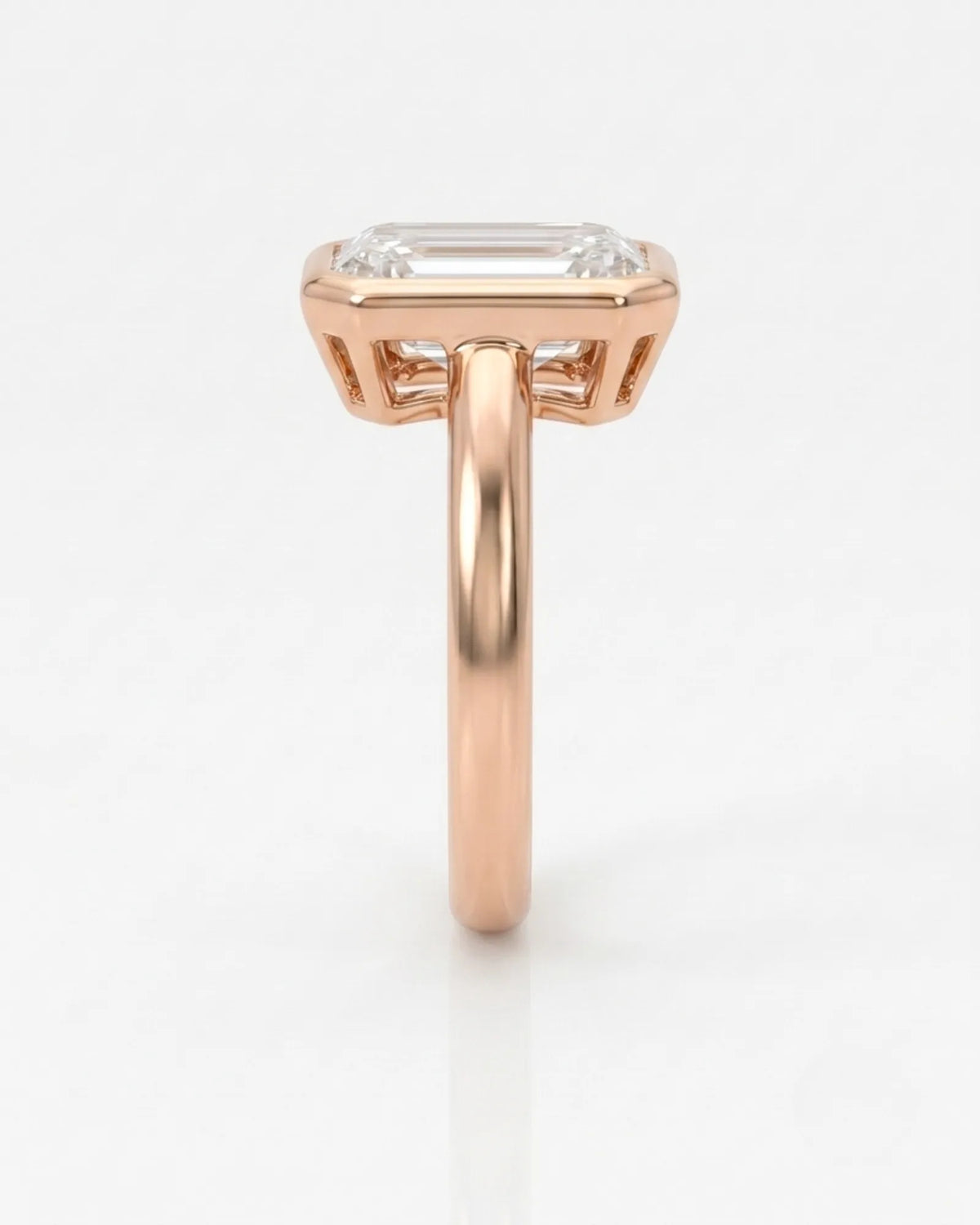 Golden Horizon natural emerald cut diamond bezel engagement ring in rose gold side profile | SARATTI