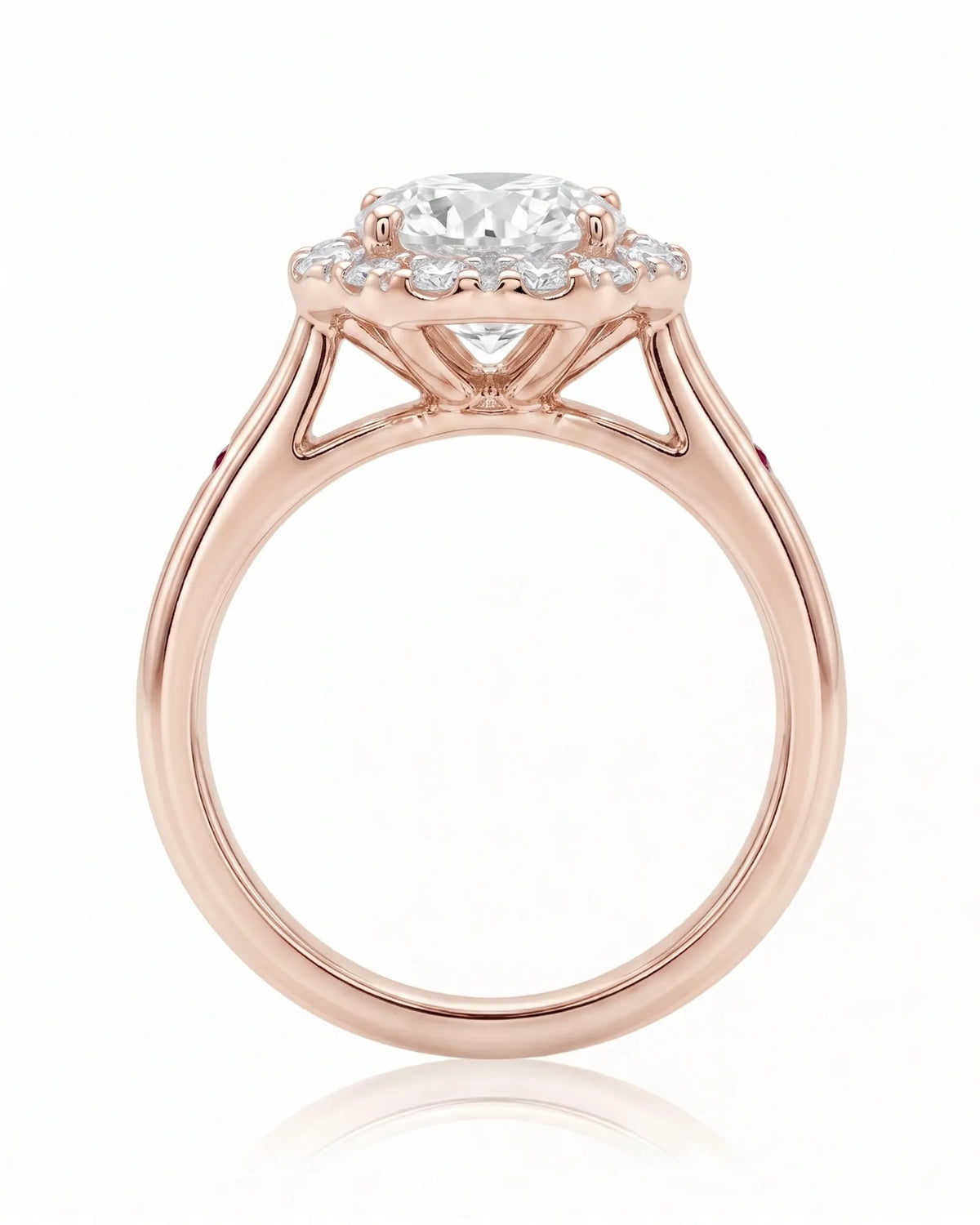 LILA 1 carat round natural diamond halo engagement ring with natural ruby shoulder accents in 18K rose gold, side profile showing four-prong crown and open gallery | SARATTI