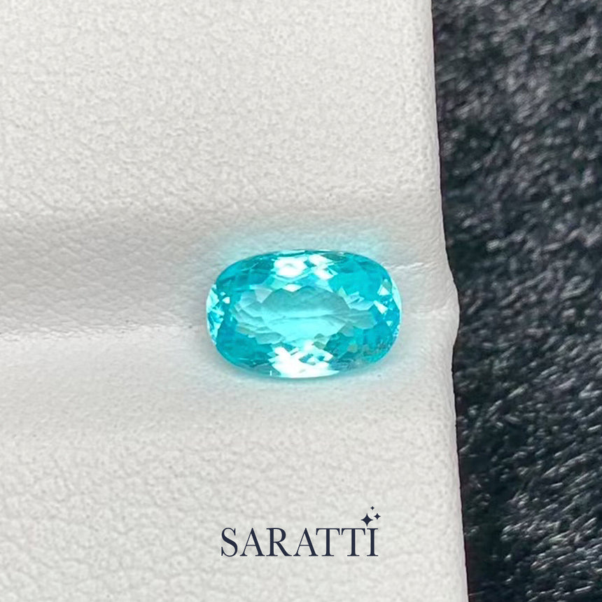 neon blue tourmaline oval cut faceted loose gemstone macro | SARATTI
