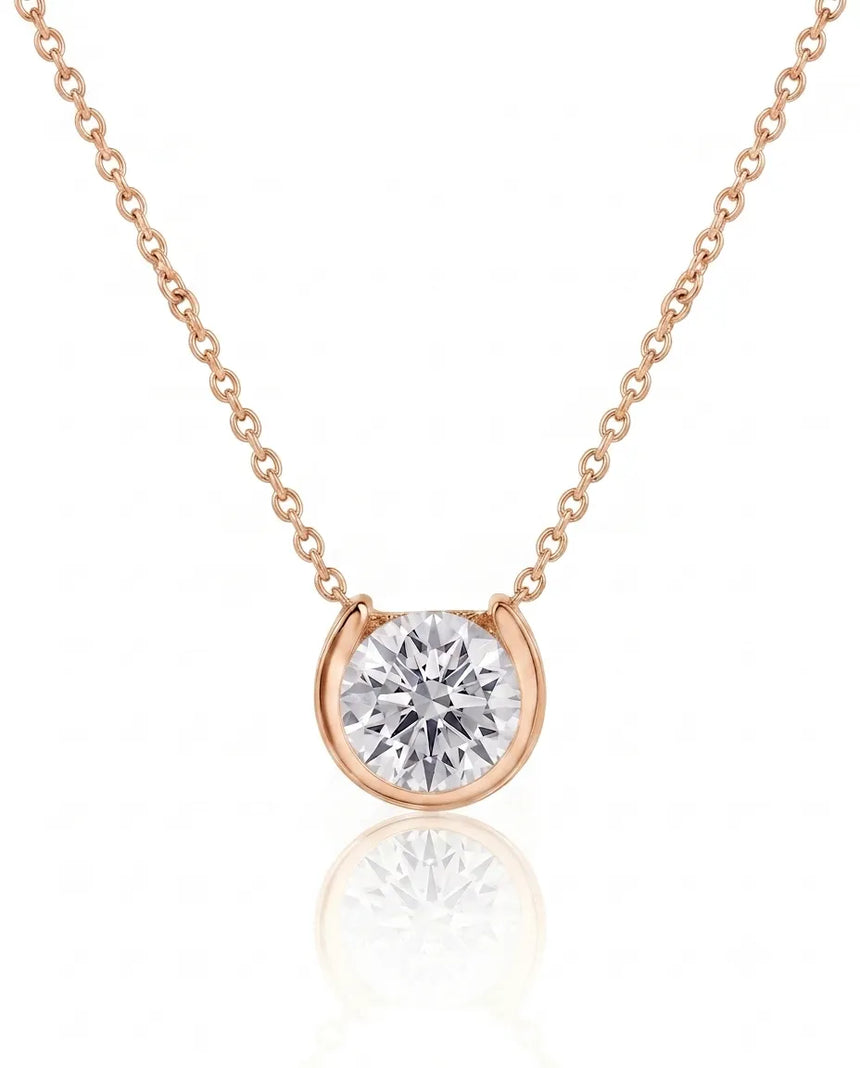 Petite bezel round diamond solitaire necklace in 18K Rose Gold, front view | SARATTI