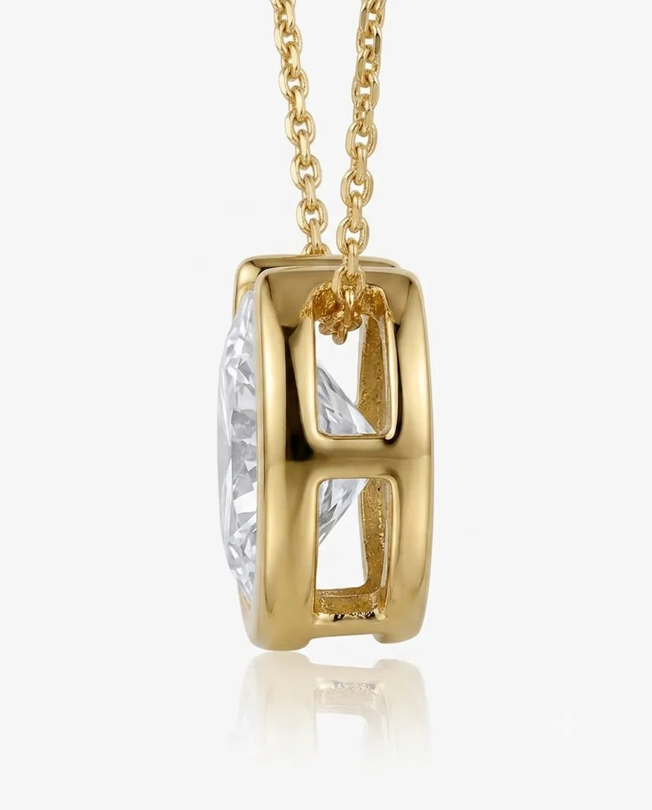 18K Yellow Gold bezel diamond solitaire necklace, side profile view | SARATTI