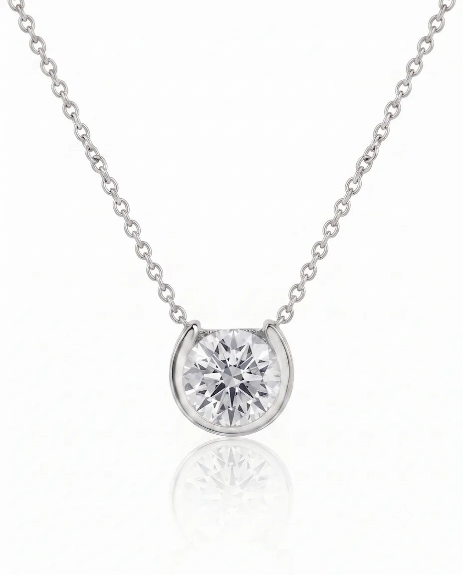 Petite bezel round diamond solitaire necklace in Platinum, front view | SARATTI