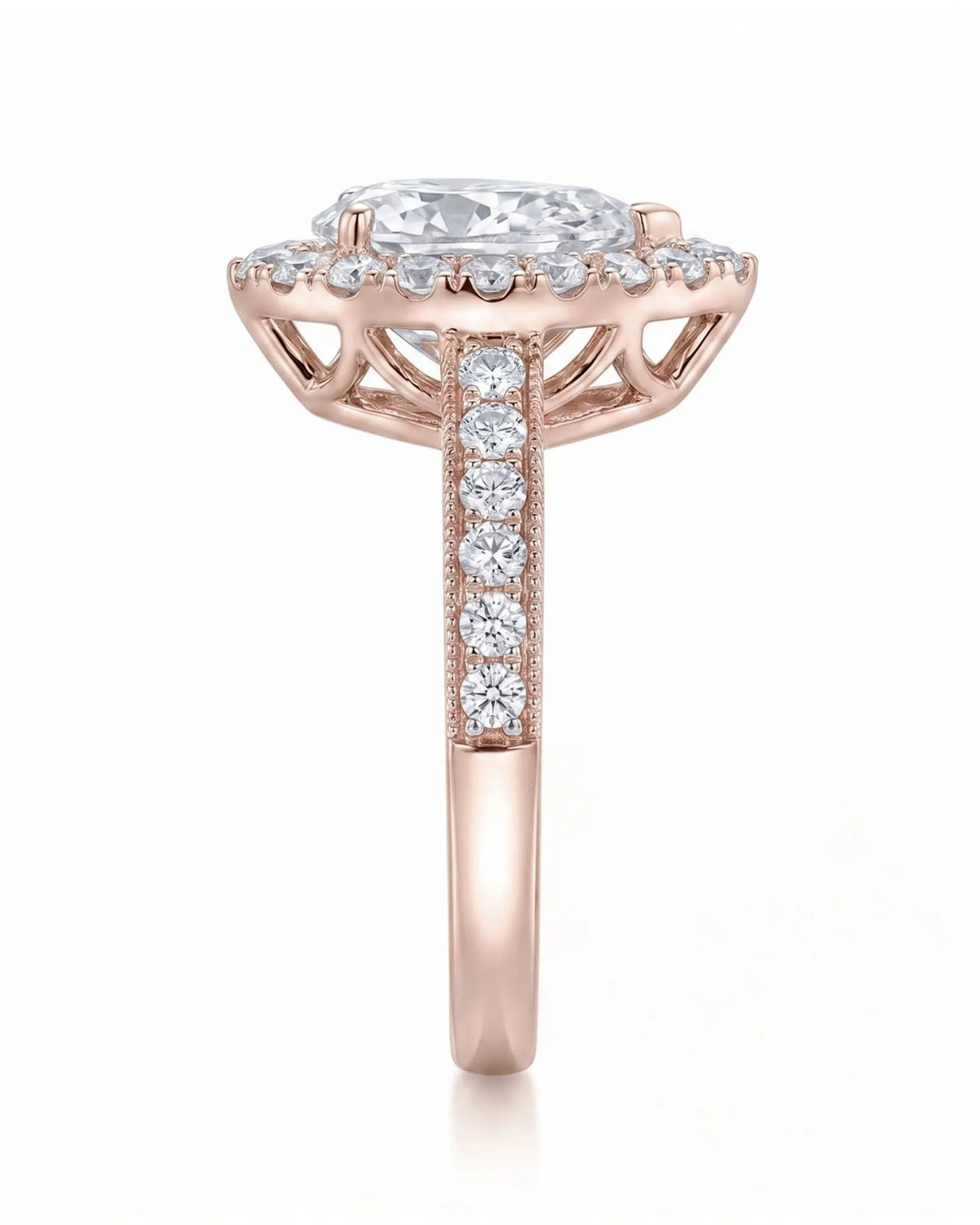 ROSE 1 carat F-colour pear natural diamond halo ring in 18K rose gold, side profile showing raised halo gallery | SARATTI