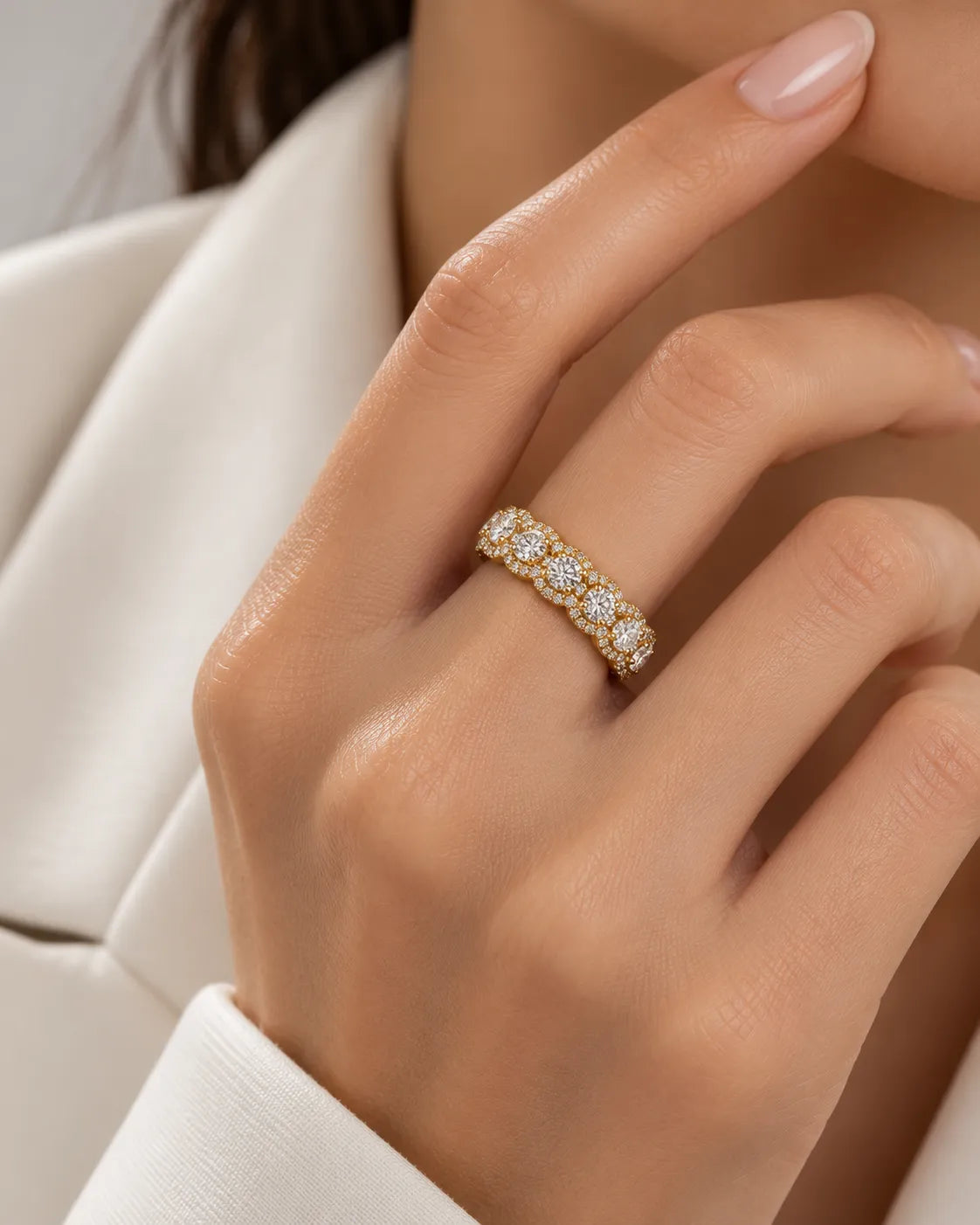 Close-up of round diamond cluster eternity band in 18K yellow gold | SARATTI
