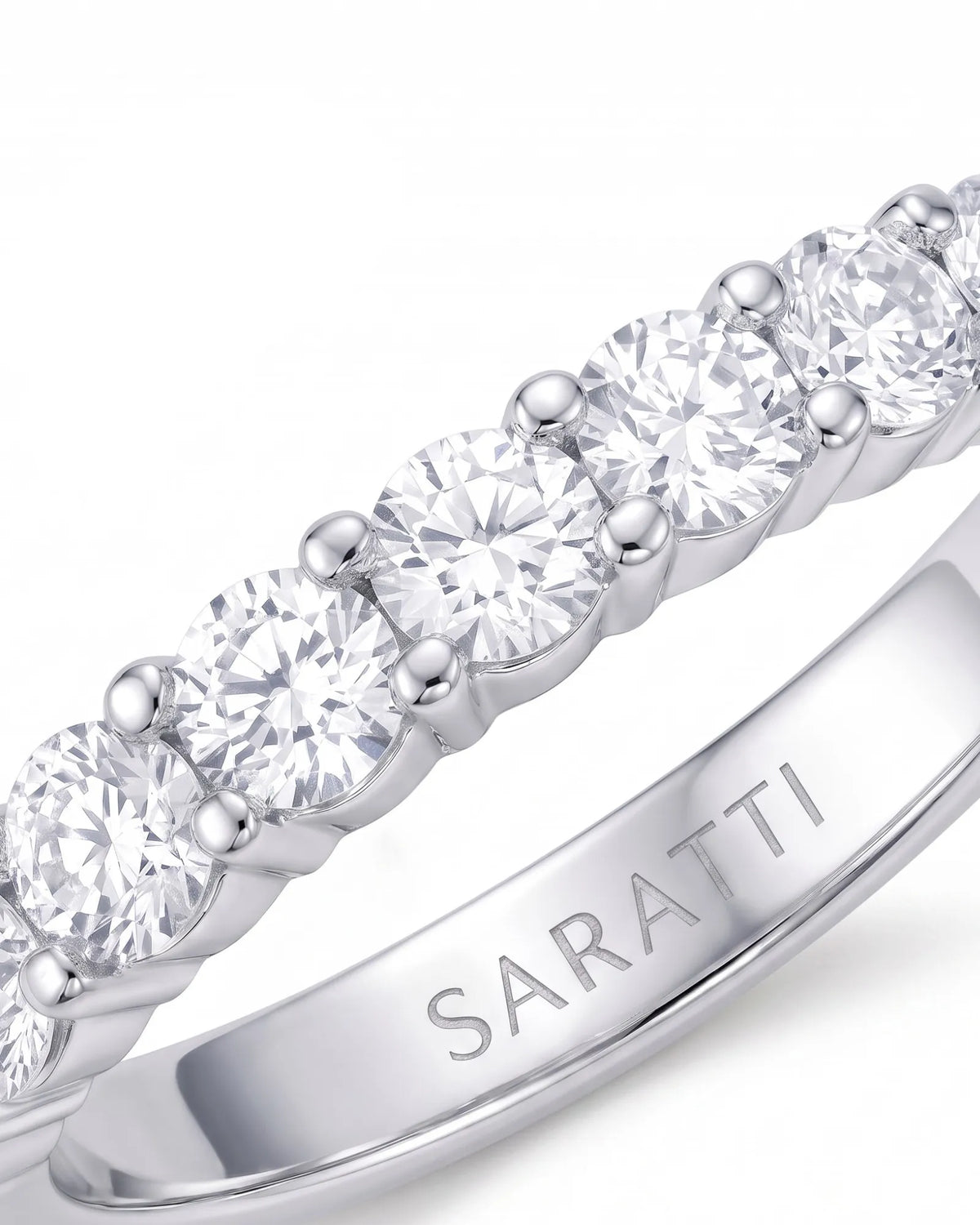 18K white gold half eternity diamond band with round diamonds across the visible face | SARATTI