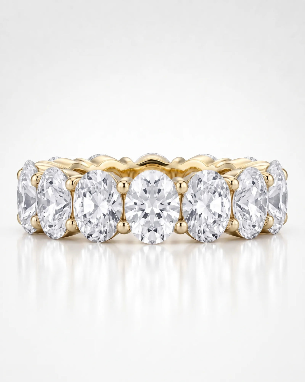 Oval diamond eternity wedding band highlighting the open gallery setting | SARATTI