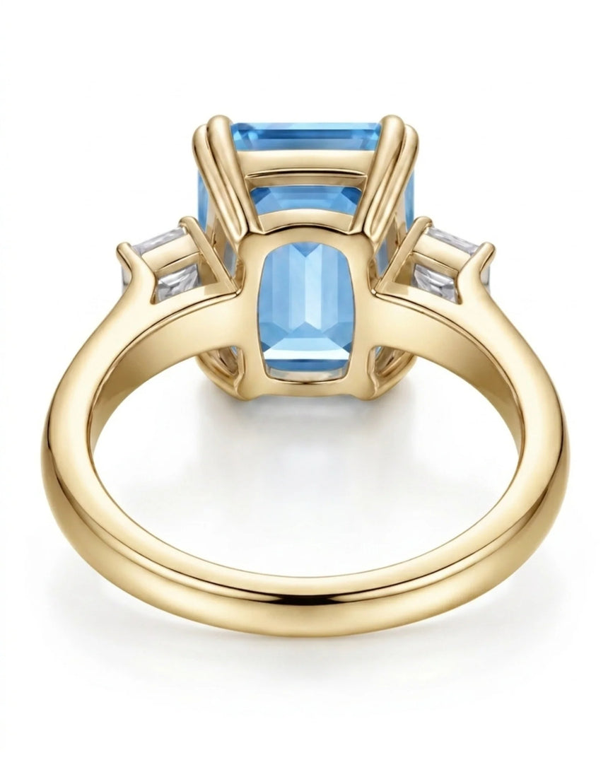 Trilune emerald-cut Aquamarine emerald-diamond step-cut three-stone ring setting in Yellow Gold, front view | SARATTI