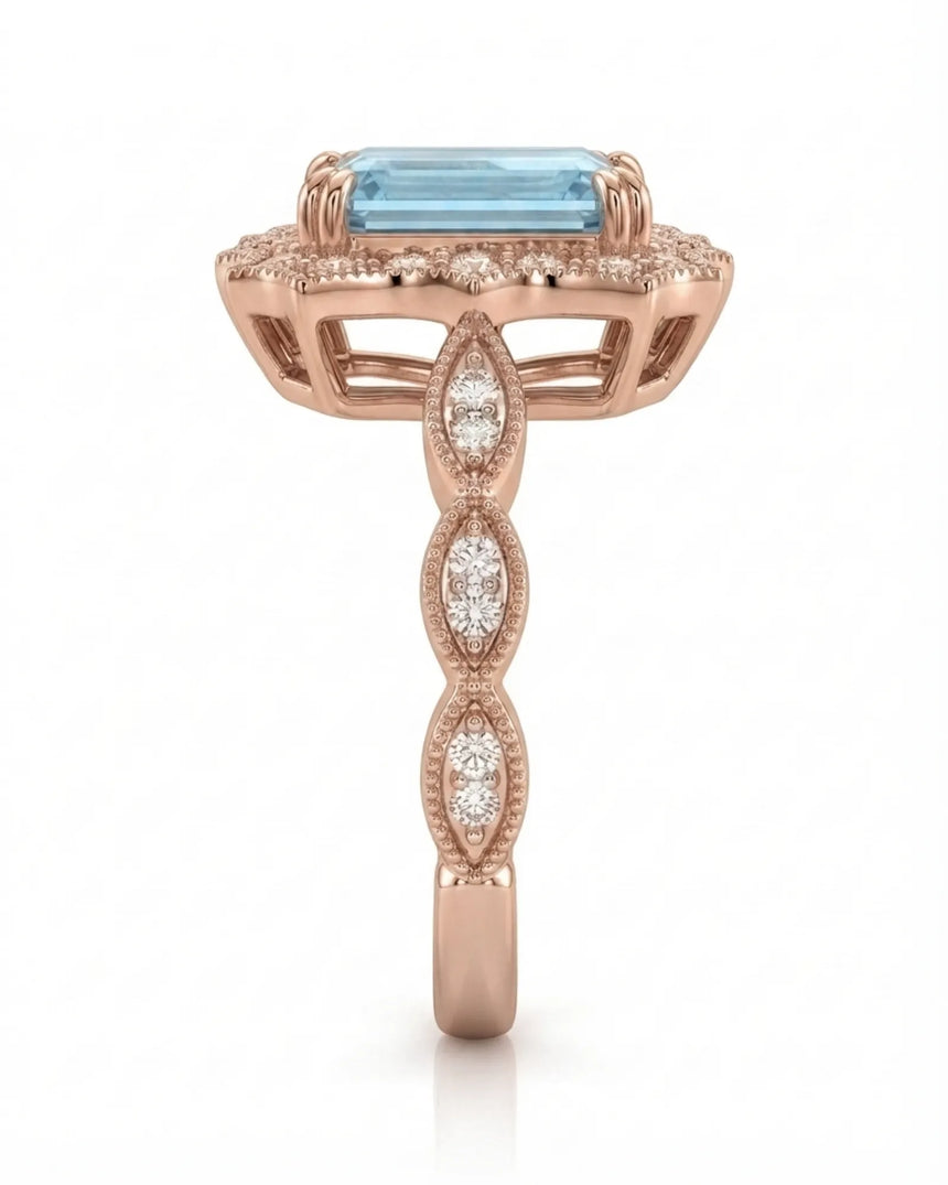 Valoria Crest emerald-cut Aquamarine ring setting in rose gold, side profile with open crown gallery and diamond links | SARATTI