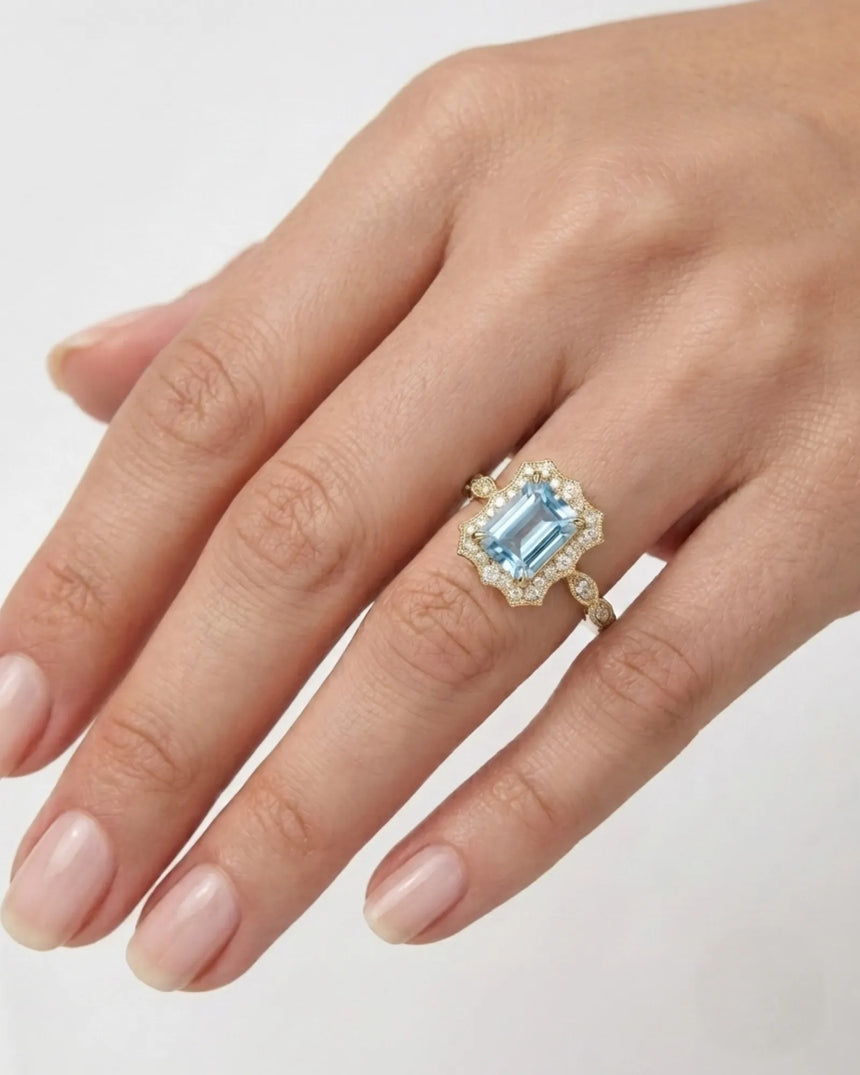 Valoria Crest emerald-cut Aquamarine vintage diamond ring setting in yellow gold, worn on hand | SARATTI