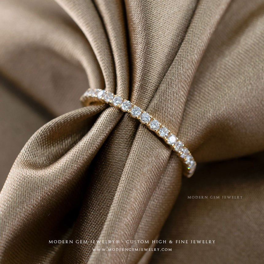 Thin Pave Set Diamond Wedding Band in Yellow Gold with Diamonds on Silk Sheets| Modern Gem Jewelry | Saratti