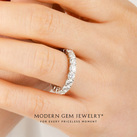 Cushion Cut Diamond Eternity Wedding Band in 18K White Gold on Woman's Finger | Modern Gem Jewelry | Saratti