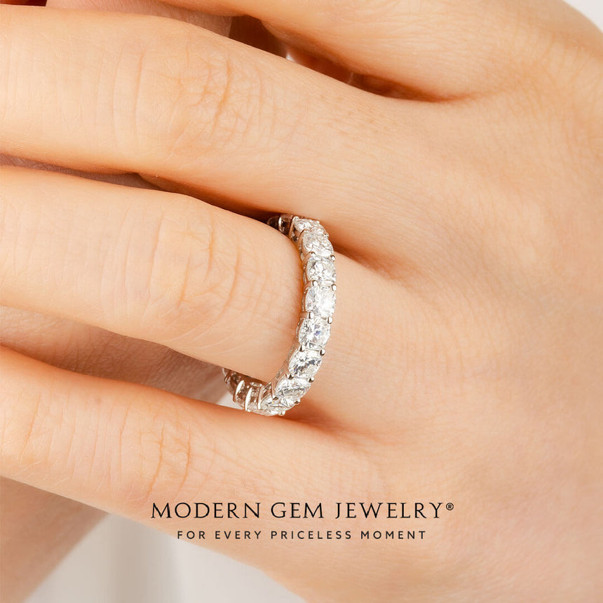 Cushion Cut Diamond Eternity Wedding Band in 18K White Gold on Woman's Finger | Modern Gem Jewelry | Saratti