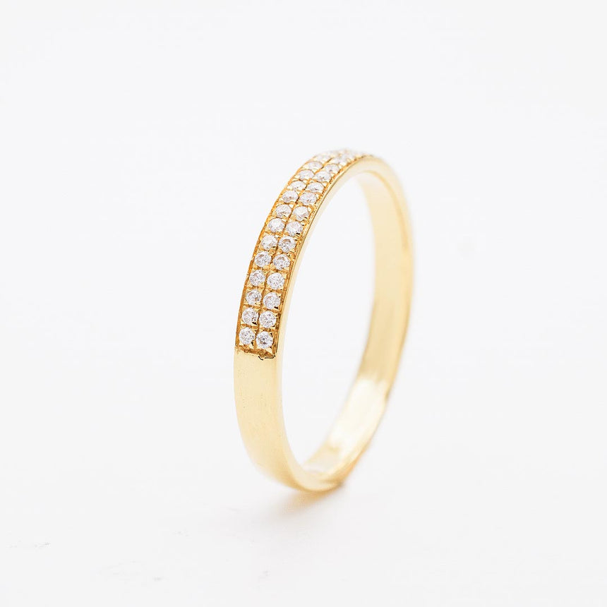 Pave Set Diamond Eternity Band in Yellow Gold on White Background | Modern Gem Jewelry | Saratti