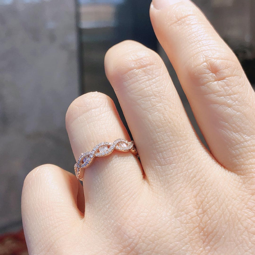 Rose Gold Eternity Band with Baguette Diamonds on Female Finger | Modern Gem Jewelry | Saratti