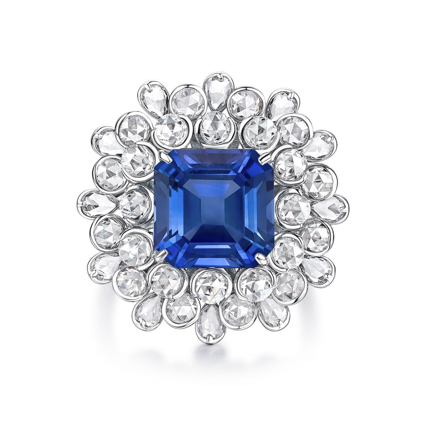 Natural 6 carat Royal Blue Sapphire with Diamond Halo Ring