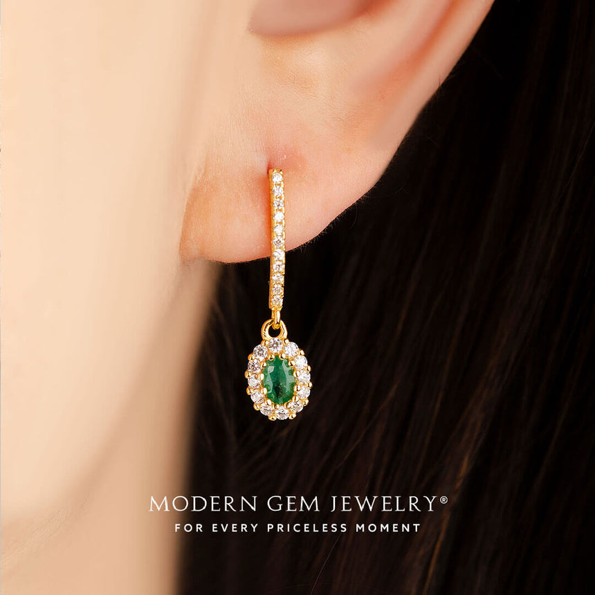 model wears oval emerald natural diamond pave earrings